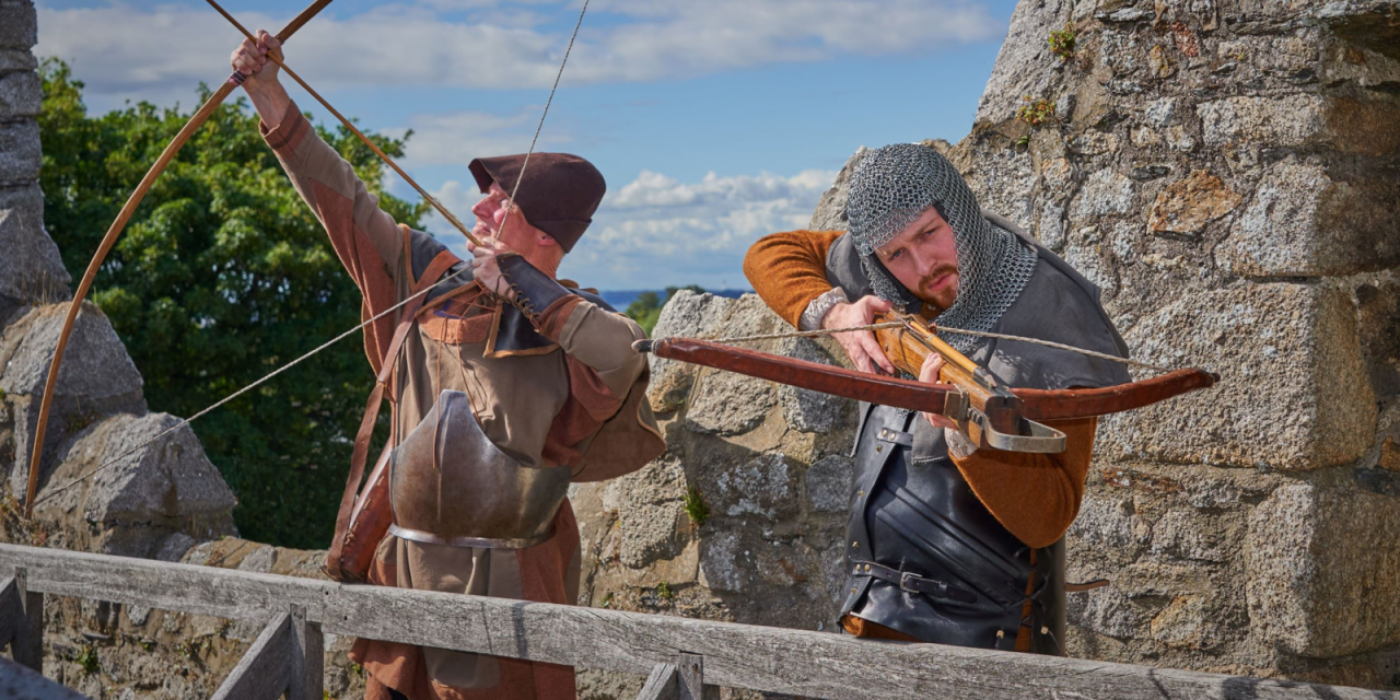 actors with crossbow and bow and arrow at dalkey castle, dublin, ireland